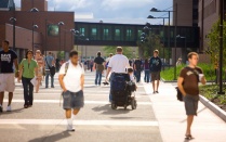 Students walking and traveling by wheelchair on North Campus. 