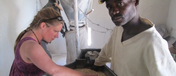 Laura Smith inspecting corn.