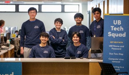 Tech Squad students working at the walk-up service counter in Silverman Library, on the 3rd floor.