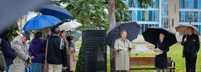 Charles F. Zukoski (center) speaks during the dedication ceremony for the memorial garden. Also speaking were Laura Hubbard (second from right) and Rev. Msgr. J. Patrick Keleher (far right). Photo: Douglas Levere.