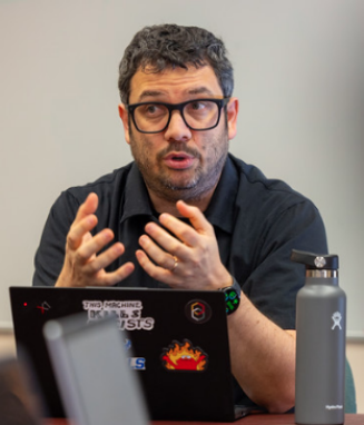 Yotam Ophir, with the department of communication, holds a class discussing media effects and misinformation, through the Extremism MEME Lab.