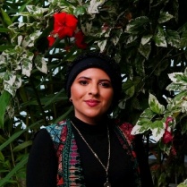 Headshot of Renad Aref.