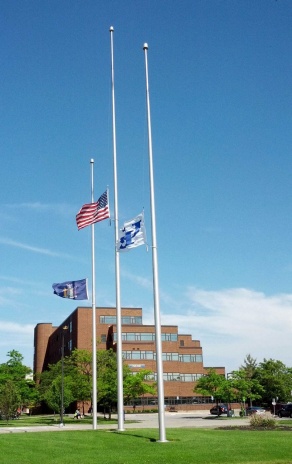Flags at half staff.