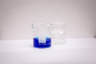 A beaker containing a methylene blue solution. 