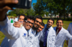 Residents move outside to take a celebratory selfie. Photo: Douglas Levere