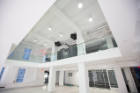 The first floor lobby from the main entrance. The public will be invited into this space for shows and lectures. Note the two black boxes (projectors) in the center.