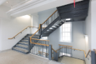 A stairwell inside the building, which is an icon of the South Campus and steps away from University Station, a public transit hub.