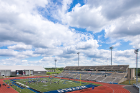 The UB Bulls take the field on a beautiful summer day at UB Stadium.