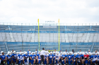 Players take a knee as coach Maurice "Mo" Linguist addresses the team.