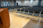 Lecture-style seating is available for up to 300. Picture shows 145 All, seating for 200 with a podium, and reception area in the back with bistro tables.