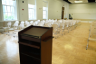 Lecture-style seating is available for up to 180, with space for refreshments and presentation. Photo shows presenter's view and seating for 160.