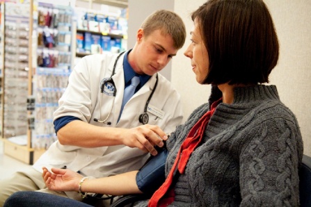 Pharmacy student interacting with a client.