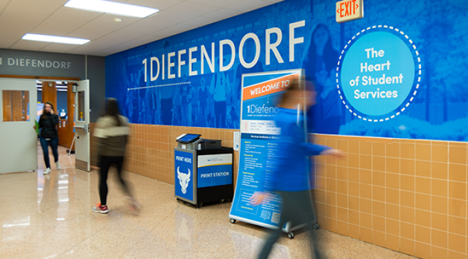 Students walking past the 1Diefendorf entrance.