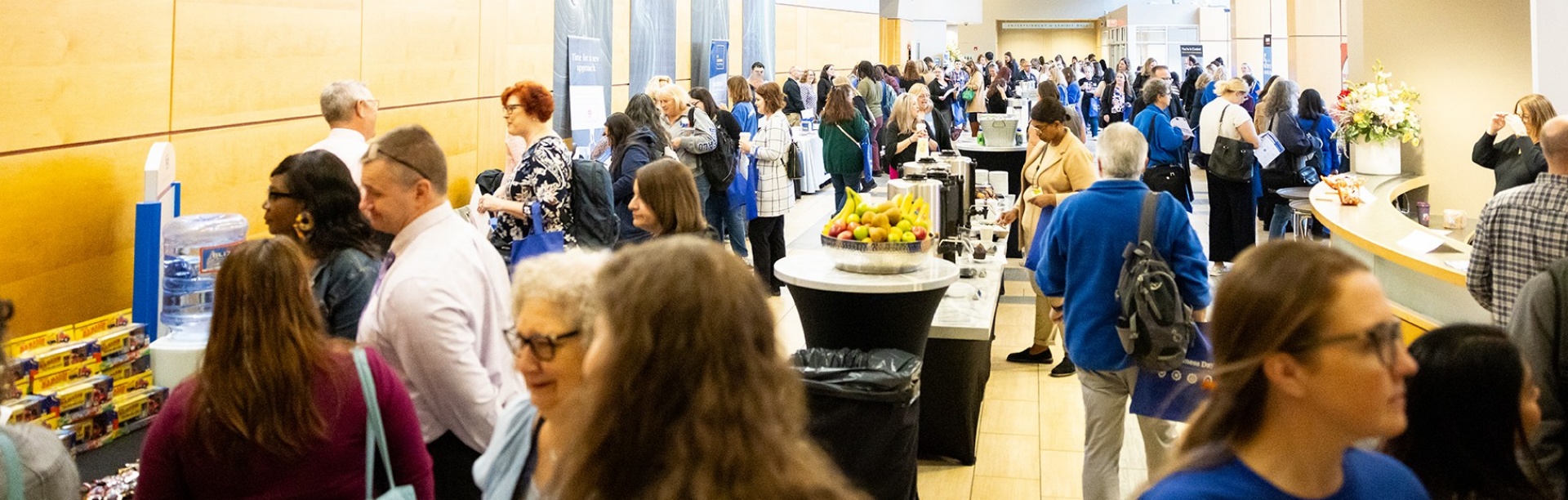 UB Business Day 2024 attendees and vendors in the Grand Foyer of the Niagara Falls Convention Center. 