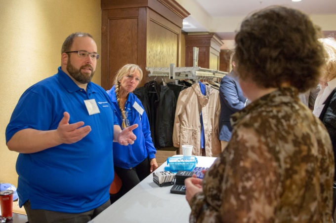 Members of Business Services speak with an attendee at Business Day in 2018. 