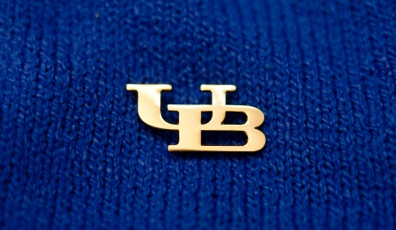 UB pin on a blue background.