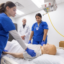 Students participate in a patient death simulation training through the School of Nursing in Wende Hall in May 2023.