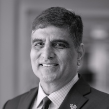 A portrait of Venu Govindaraju after he spoke at a meeting of the Buffalo Niagara Partnership in Buffalo, NY in January 2024. The presentation was titled Convergence of Artificial Intelligence to solve societal problems. Photographer: Douglas Levere.
