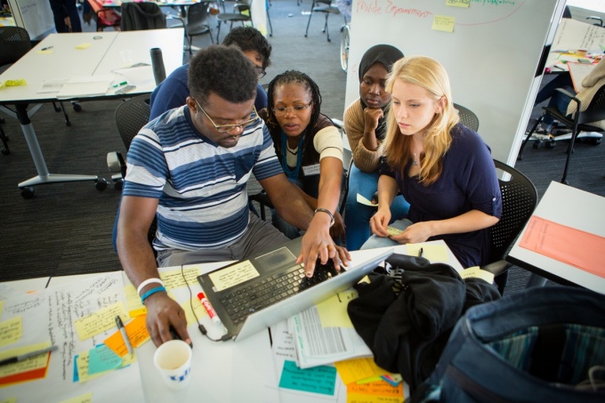 UB students working together to solve a problem.