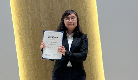 Jenny Nyugen displays her certificate of participation at conclusion of the 2023 Korea America Student Conference.