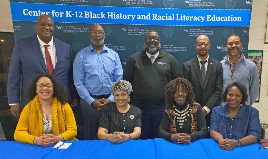 Zoom image: November 7, 2024: Group photo at the event marking the 70th anniversary of Brown v. Board of Education. Pictured, from left, seated: Graduate Fellow Abigail Henry, Panelists Donette Ruffin, Kathleen “Kathy” Franklin Adams, and Nanette Massey. Standing: Hon. Terrance Heard, Panelist Mario Workman, Organizer LaGarrett King, Moderator Anthony White II, and Discussant Marcus Watson. 