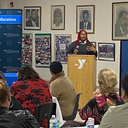 Zoom image: Jillian Hanesworth, the Poet Laureate Emeritus of Buffalo, at the podium during the event marking the 70th anniversary of Brown v. Board of Education. 