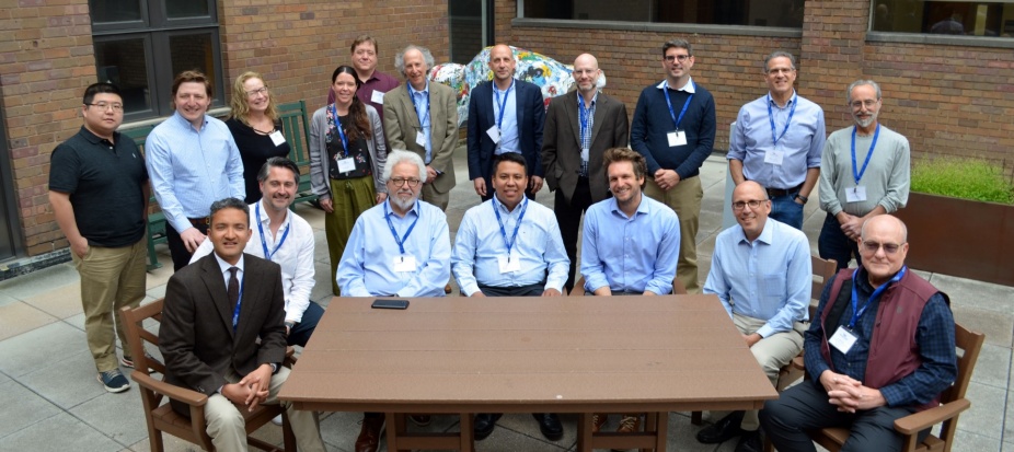 Zoom image: May 17, 2024: Participants gather for the first day of the workshop, Transnational Legal and Political Theory. Pictured: seated (from left) Aravind Ganesh, Cormac Mac Amhlaigh, John Linarelli, Jorge Luis Fabra-Zamora, Paul Linden-Retek, Paul Schiff Berman, Errol Meidinger. and, standing (from left): Xi Zhang, John Giammatteo, Kim Diana Connolly, Nicole Roughan, Josh Coene, Jeff Dunoff, Thomas Schultz, Michael Giudice, David Lefkowitz, Jim Gardner, Guyora Binder. 