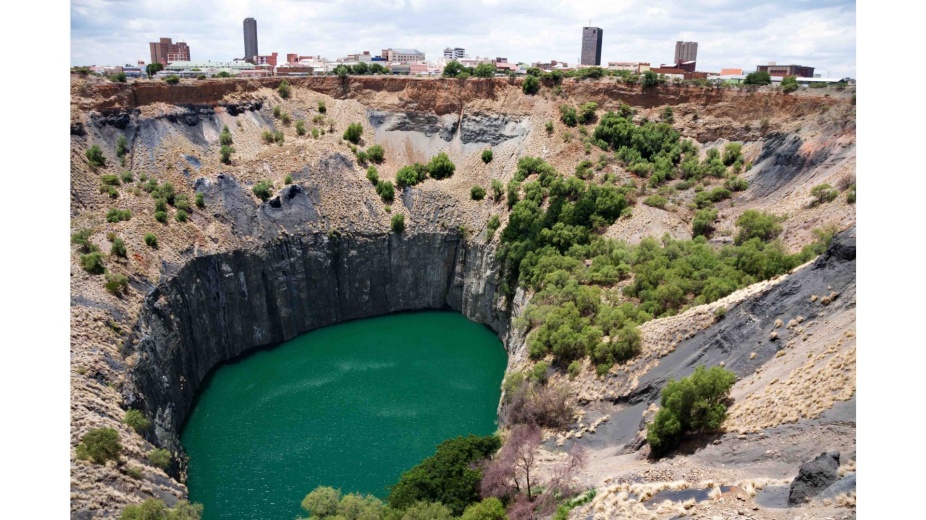 Photograph: Big Hole, Kimberly, South Africa, where the company, De Beers Consolidated Mines Limited, originated in 1888. The mining operations closed in 1914. Today, the site is now a tourist destination supported in part by the company and based on the theme "Diamonds and Destiny".