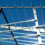 The metal framework of the Murchie Fieldhouse on UB's north campus, reflecting the sunlight as it is being built. 