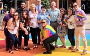 Residence life staff on the rainbow crosswalk in front of the Student Union.