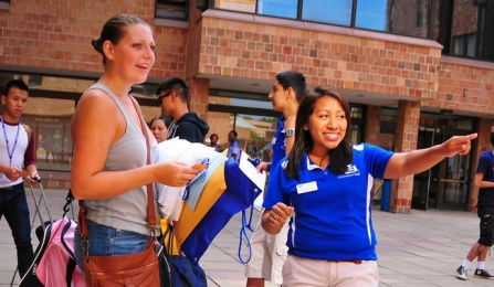 student leading a walking campus tour.