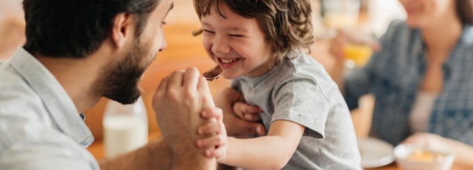 child playing with parents.