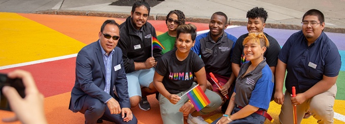 staff in the pride cross walk near the student union.