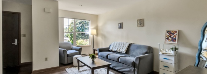 Interior of a staged Creekside Village apartment living room.