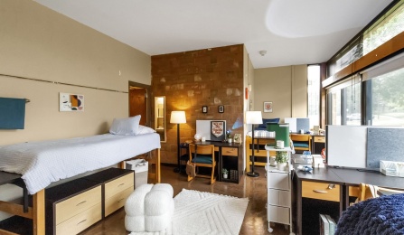 Staged quad bedroom with bath suite in Ellicott Complex.