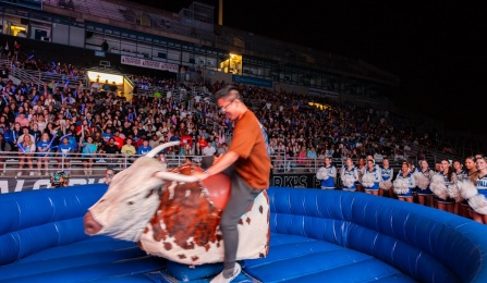 An energized crowd looked on in amazement as UB students did their best to stay on the mechanical bull during the Bulls Welcome Back Blast. 