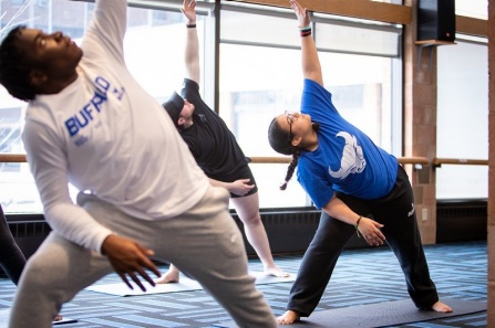 Students taking a yoga class at University at Buffalo.