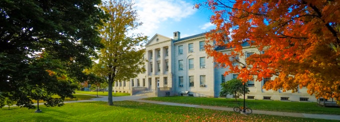 Campus buildings in the fall at sunset.