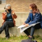 A drawing class meets outside, with Professor Joan Linder, near the Center for the Arts, on North Campus in September 2020. 