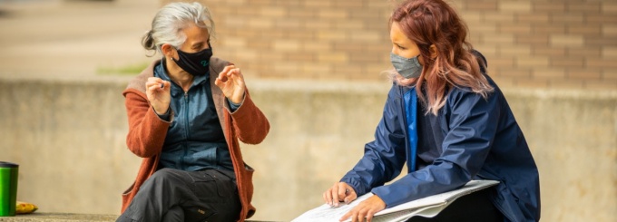 A drawing class meets outside, with Professor Joan Linder, near the Center for the Arts, on North Campus in September 2020. 