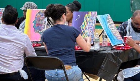 Close up of people paintining.