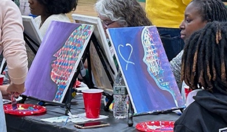 Close of up people painting.