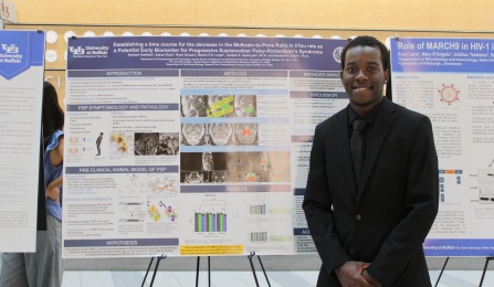 CLIMB UP 2025 participant, Kymani Getfield, with his poster at the end of summer research symposium.