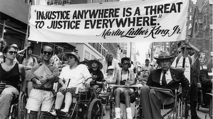 Disability rights advocates in 1993 in New York City at the "Disability Independence Parade." Judy Heumann and her fellow advocates often used the Civil Rights Movement as a model for their own activism. Judy Heumann is pictured third from the left alongside Paul S. Miller, Phyllis Rubenfeld and Justin Dart. Dart played a major role in the passage of the ADA, and was there when President George H.W. Bush signed it into law. Source: NYC Mayor’s Office for People with Disabilities.