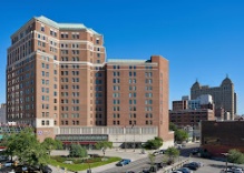 Zoom image: The Genesee Building - Hyatt Regency Hotel is a 15-story tall hotel red brick building in Buffalo, New York that was built as the Hyatt Regency Hotel in 1922 by architects E.B. Green and William S. Wicks. Photo courtesy of Hyatt Regency Buffalo. 