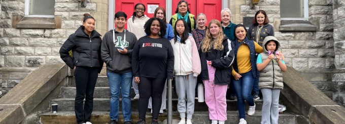 Members of UB's Daniel Acker scholars program and Pilgrim St. Luke's Church in Buffalo on the front steps of the church. 