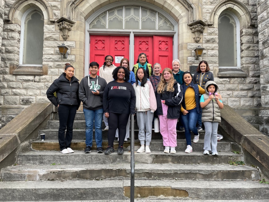 Members of UB's Daniel Acker scholars program and Pilgrim St. Luke's Church in Buffalo on the front steps of the church.