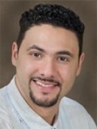 Portrait of Joel Urena smiling.