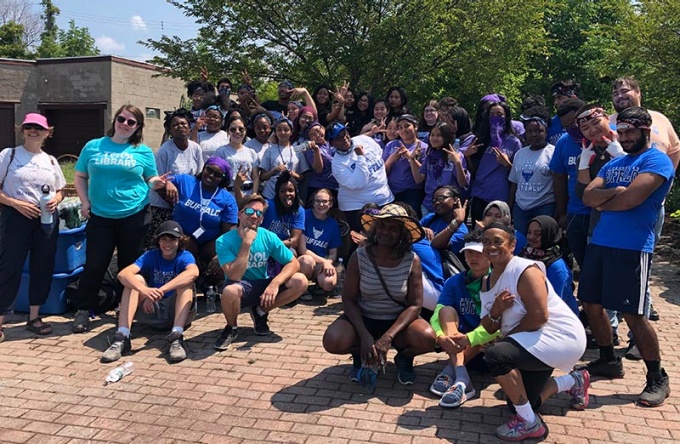 Group of students standing together outside.