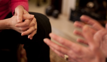 hands of those listening and speaking.